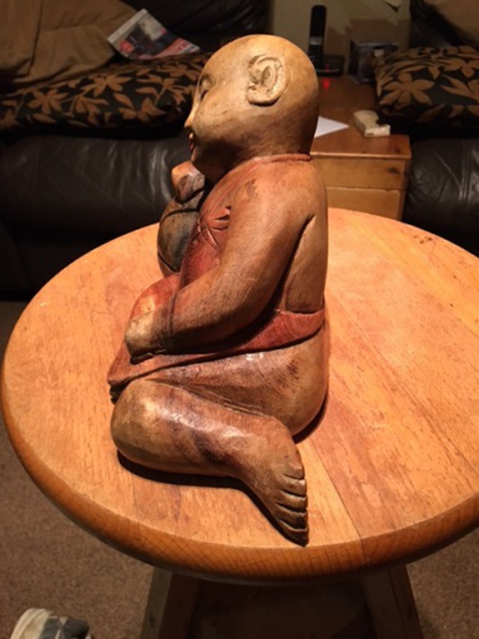 Antique This is an excellent early to mid-20th century hand carved in solid wood reclining Japanese boy