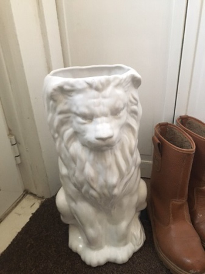 Antique A mid-20th century very handsome high gloss white ceramic umbrella holder in the form of a lion,49cm high by 19cm circumference at the top 
