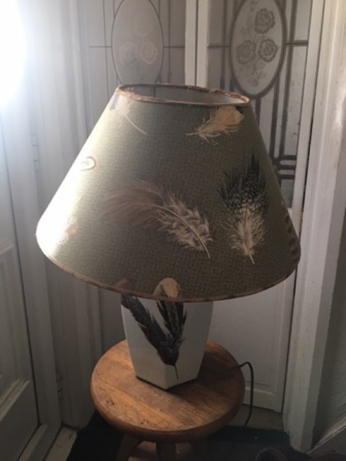 Antique Exquisite, mid-20th century white ceramic leaf pattern design table lamp with original elegant shade by the French designer Patrick Frey.