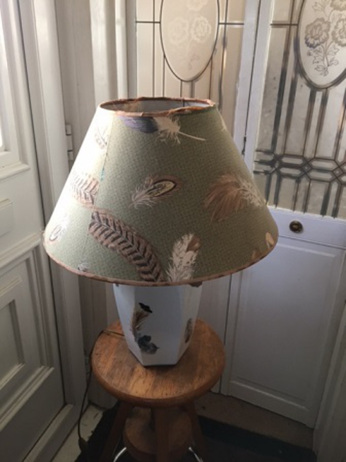 Antique Exquisite, mid-20th century white ceramic leaf pattern design table lamp with original elegant shade by the French designer Patrick Frey.