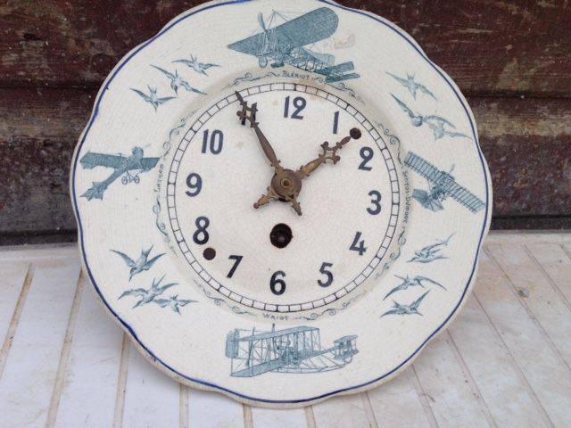 Antique French 1920’s Jaz crackle finished ceramic faced wall clock, with transfer print decoration of names of first aviators with their aeroplanes
