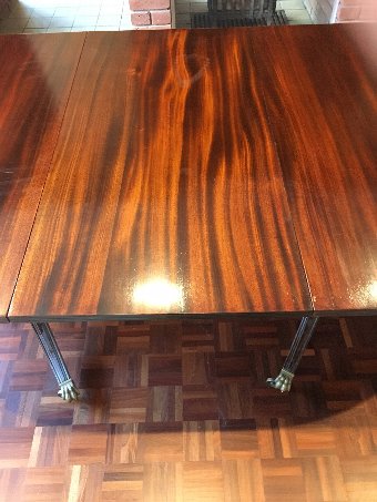 Regency style mahogany twin pillar extendable dining table