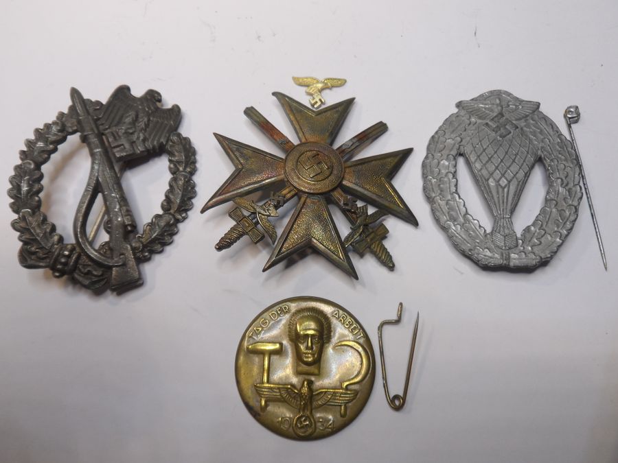 Four WW2 German Badges with slight attention needed