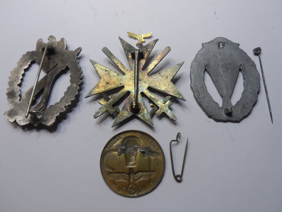 Antique Four WW2 German Badges with slight attention needed