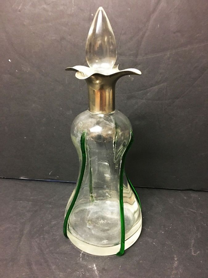 An Art Nouveau Decanter the clear fluted body.