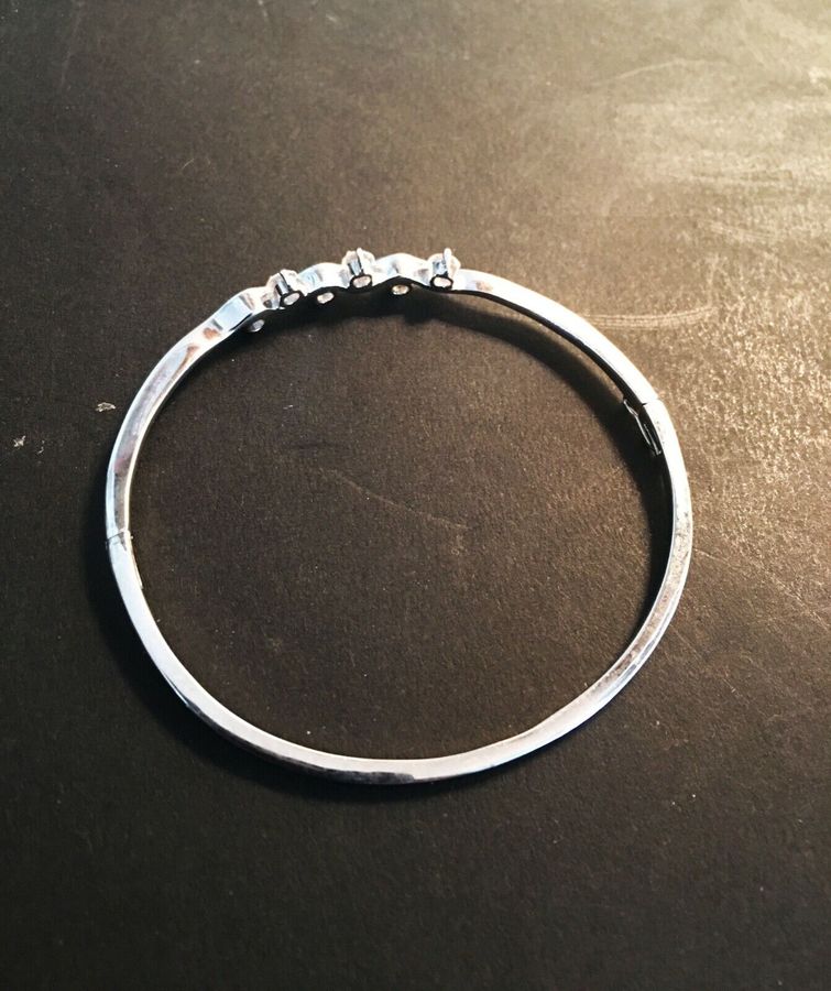 A sterling silver bangle.