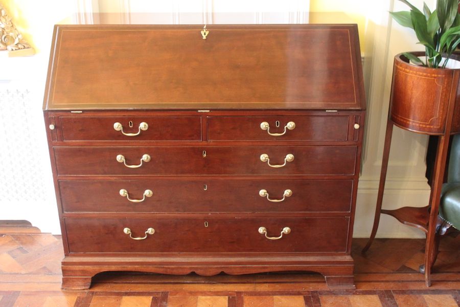 A large George III mahogany bureau with fitted interior