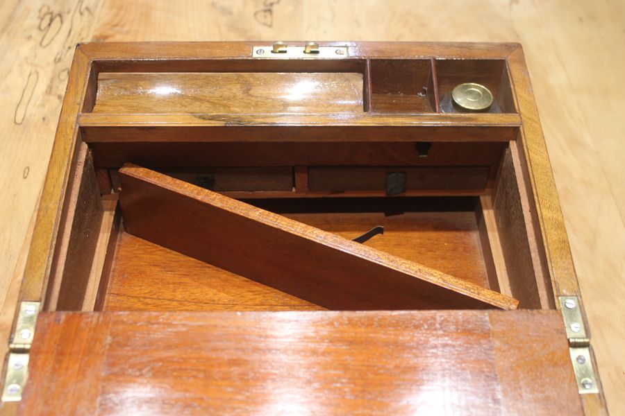 Antique A small Victorian walnut writing slope with secret drawers