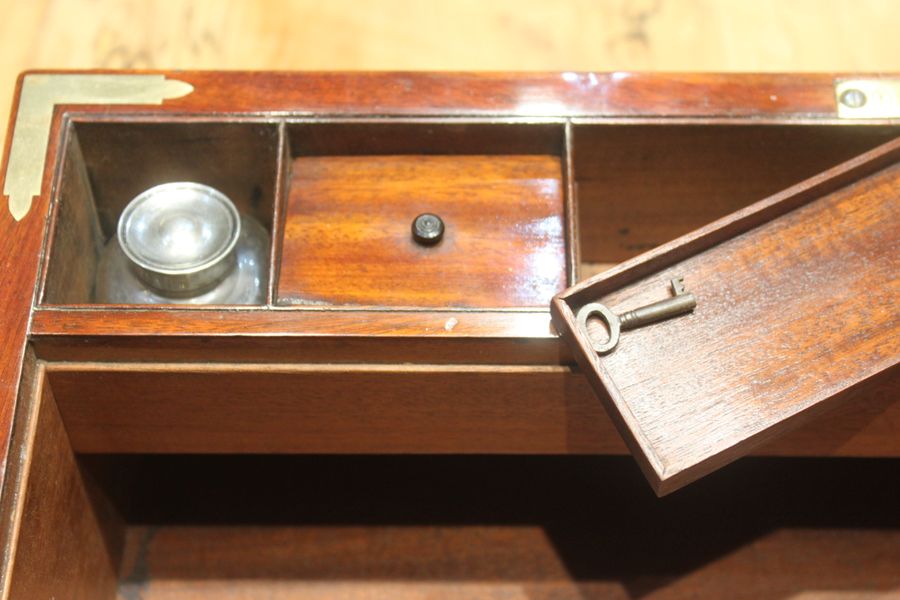 Antique Georgian mahogany and brass bound campaign writing slope. 