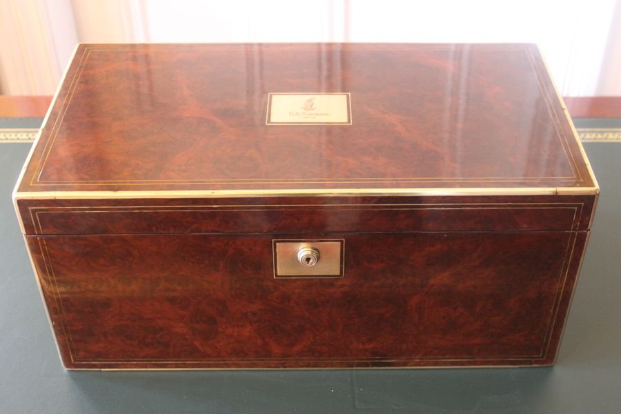 Victorian burr walnut writing slope with secret drawers and compartment.
