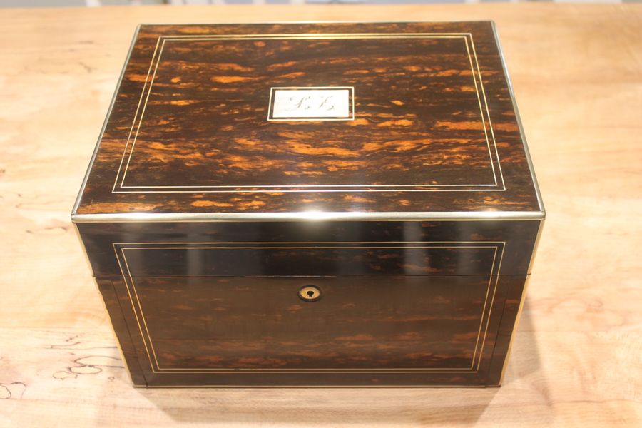 A ladies Victorian Coromandel travelling dressing and jewellery box with a fitted interior.