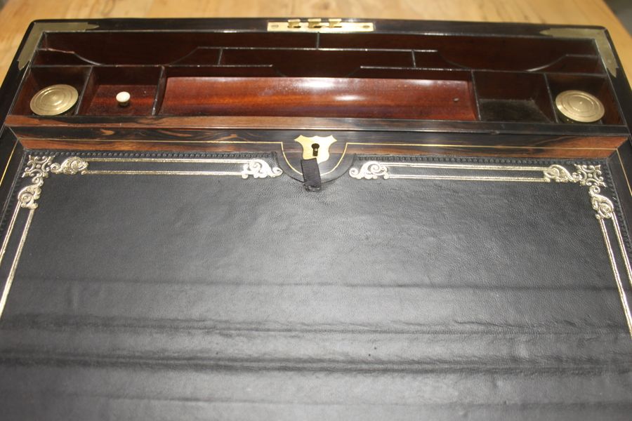 Antique A quality walnut writing slope with stationery compartments, secret drawers etc.