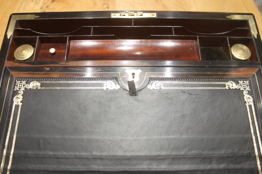 Antique A quality walnut writing slope with stationery compartments, secret drawers etc.