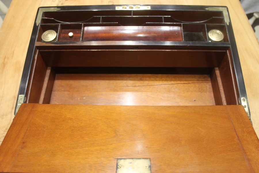 Antique A quality walnut writing slope with stationery compartments, secret drawers etc.