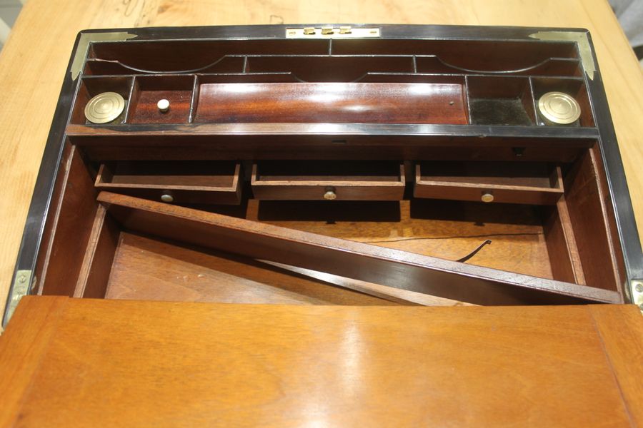 Antique A quality walnut writing slope with stationery compartments, secret drawers etc.