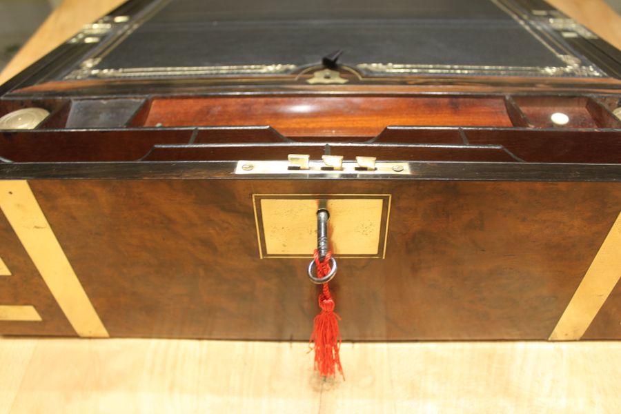 Antique A quality walnut writing slope with stationery compartments, secret drawers etc.