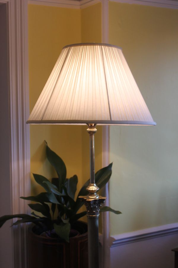 An Edwardian Corinthian column brass extending standard lamp