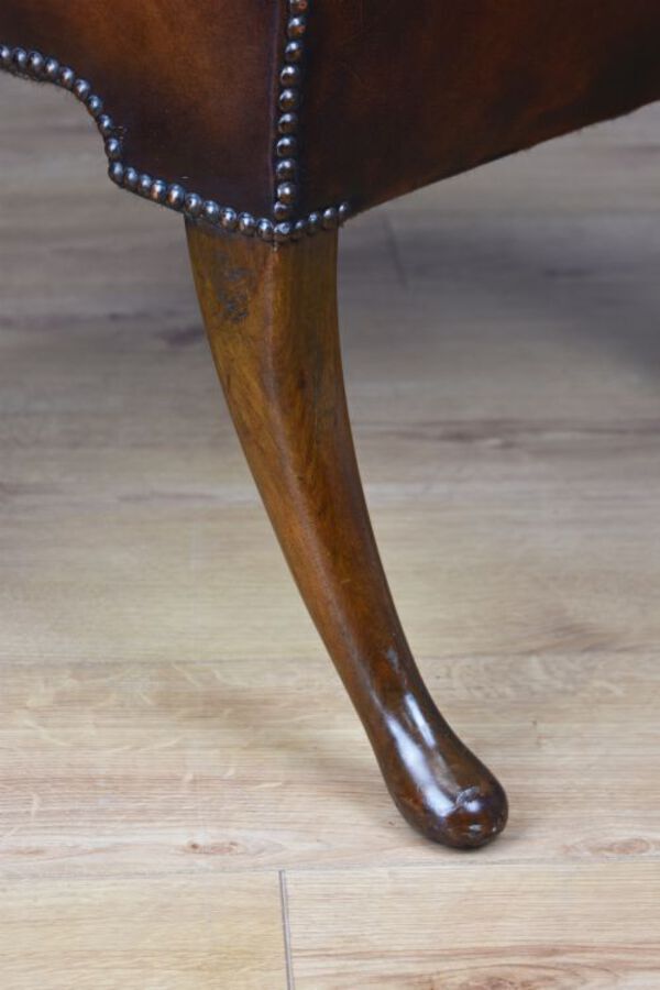 Antique 20th Century Hand Dyed Distressed Tan Leather Wingback Armchair