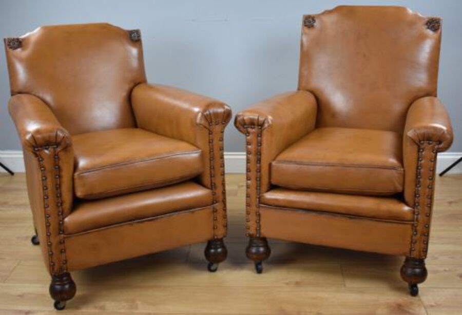 Pair Victorian Tan Leather Ladies and Gents armchairs
