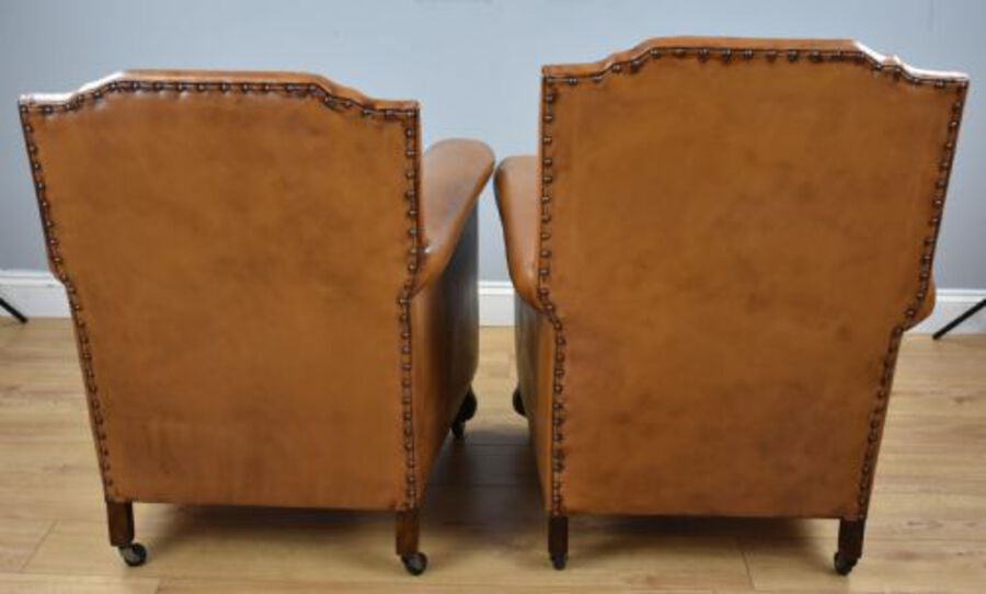 Antique Pair Victorian Tan Leather Ladies and Gents armchairs