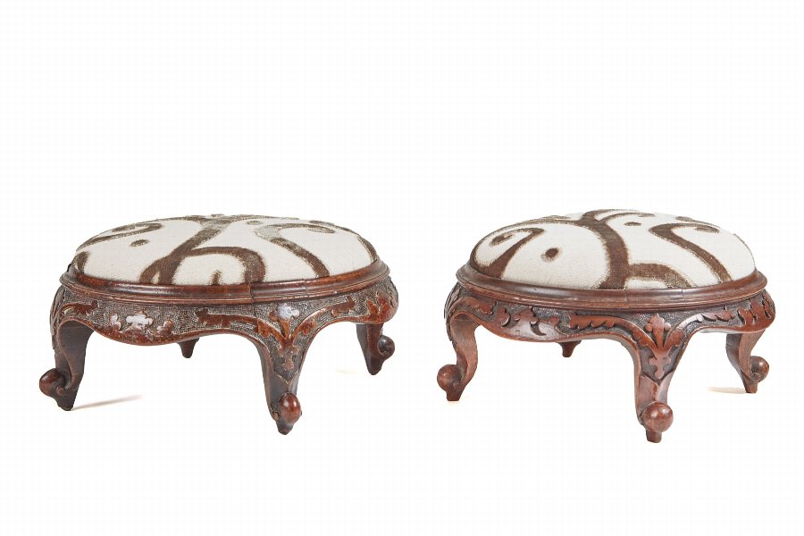 Pair of Victorian carved walnut foot stools