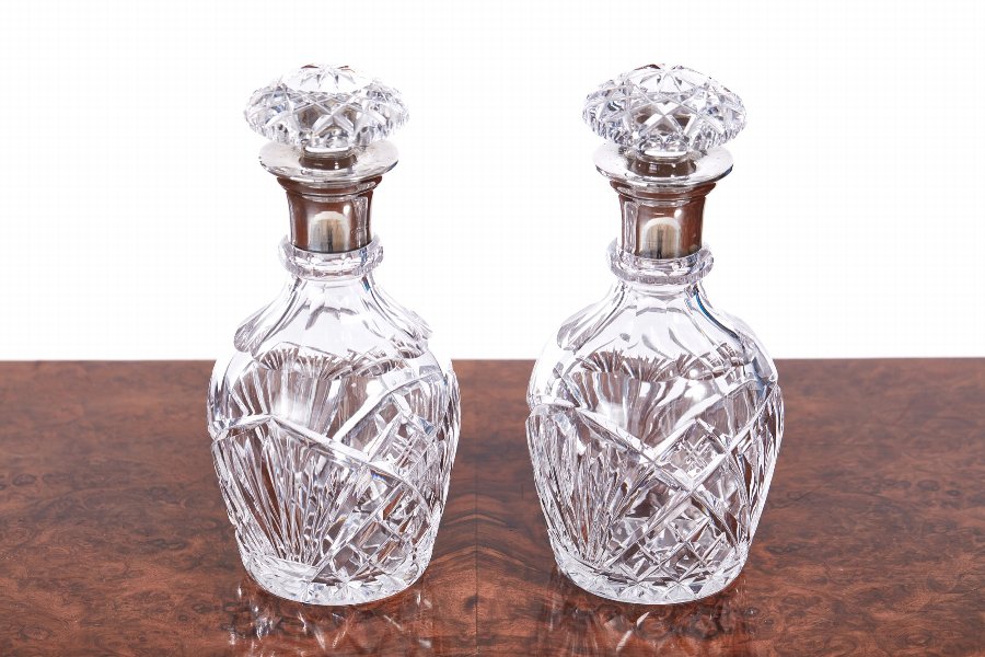 Pair Of Antique Silver Topped Cut Glass Decanters