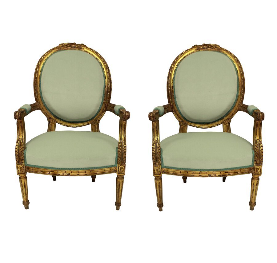 A PAIR OF LOUIS XVI STYLE GILT WOOD ARMCHAIRS