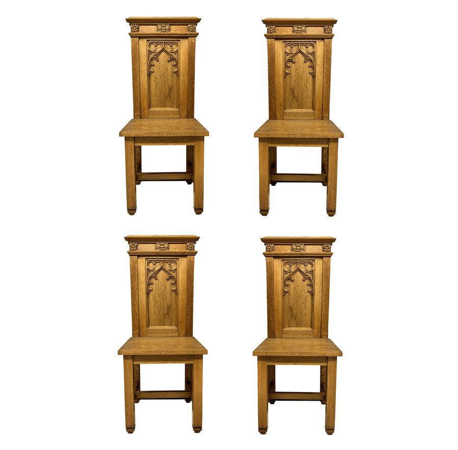 A SET OF FOUR ENGLISH OAK GOTHIC HALL CHAIRS