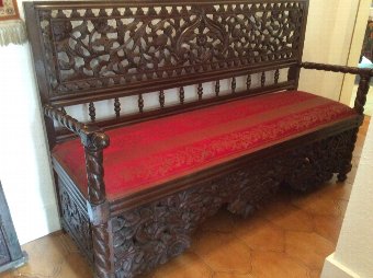 Lovely heavily carved Indonesian Bench