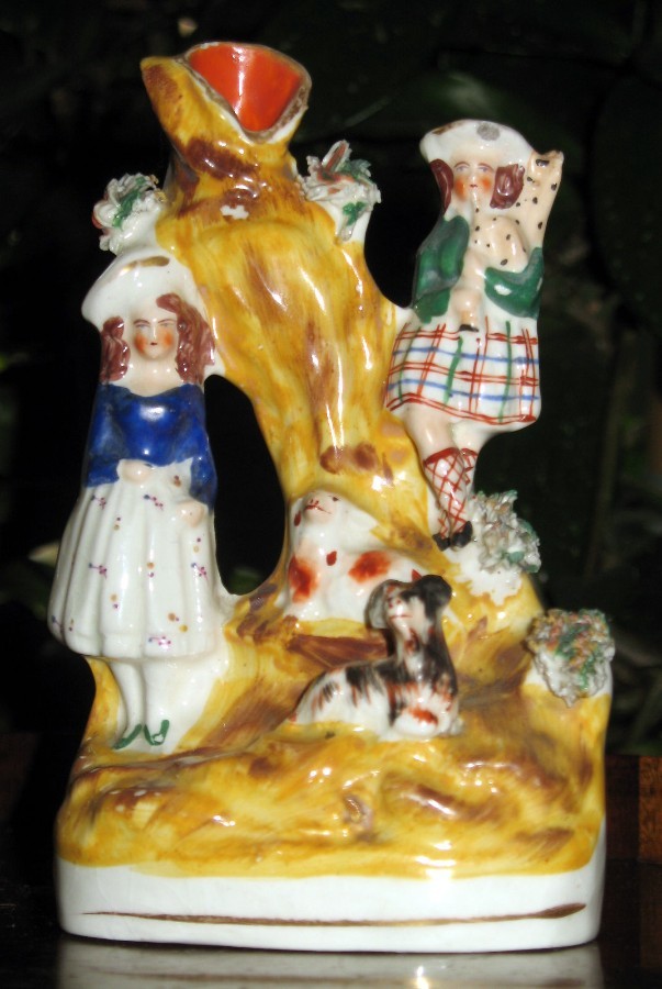 An attractive antique Staffordshire Group with a Scottish Piper Boy C.late 19th / early 20thC