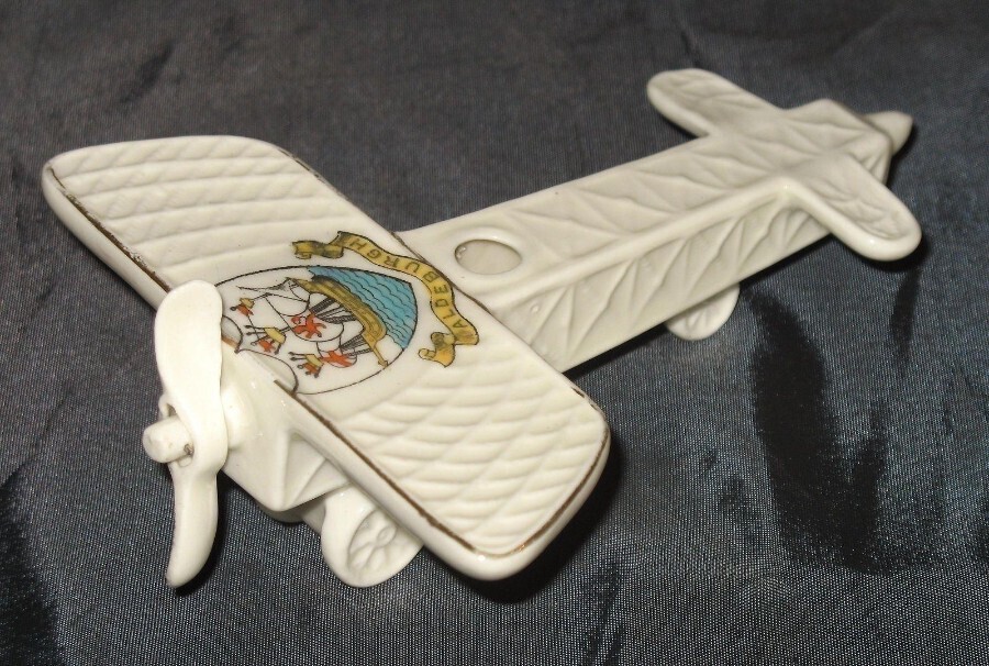 A scarce antique Arcadian crested china model of an early Monoplane - Military C.1914