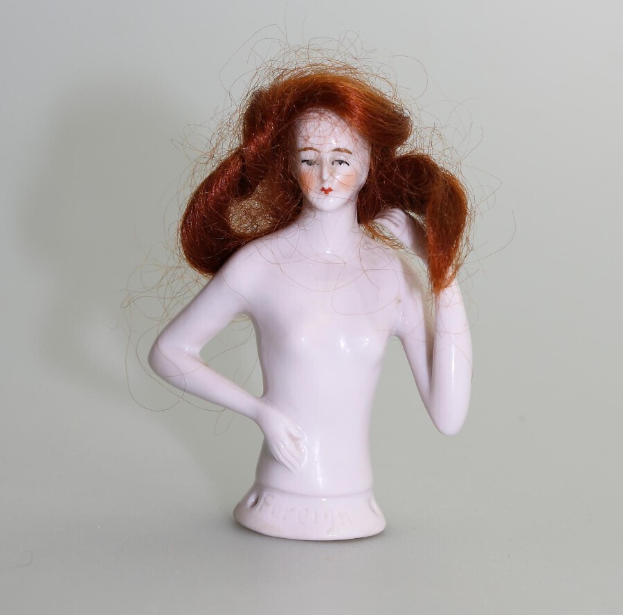 A good antique porcelain European half doll / with hair C.1920's