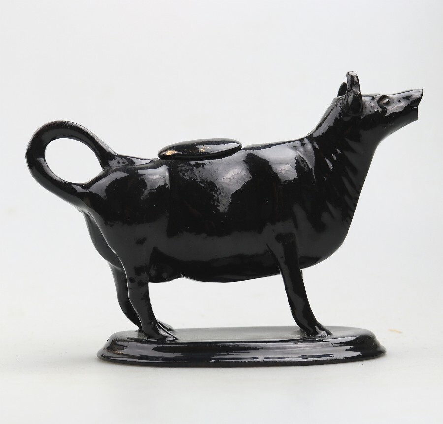 A good antique Staffordshire Jackfield pottery novelty Cow Creamer C.19thC