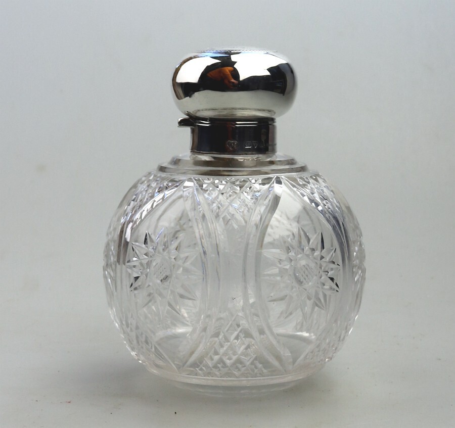 A good antique solid silver & cut glass globular Scent Bottle Chester 1911