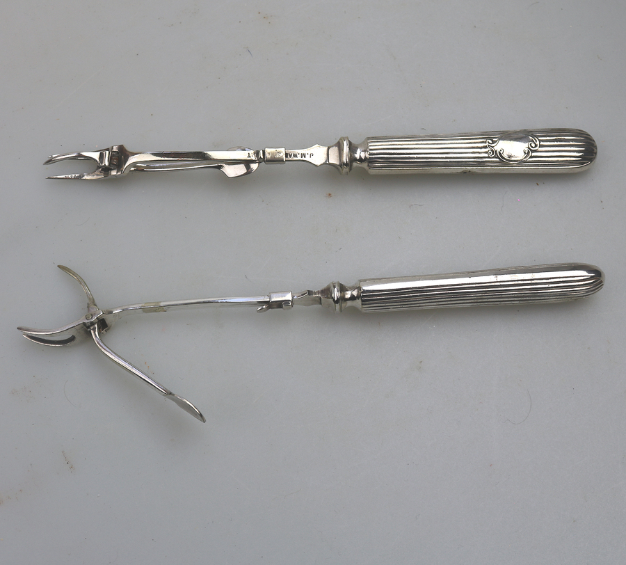 A rare pair antique silver plate mechanical Wades Patent novelty Pickle / Olive Forks C19thC