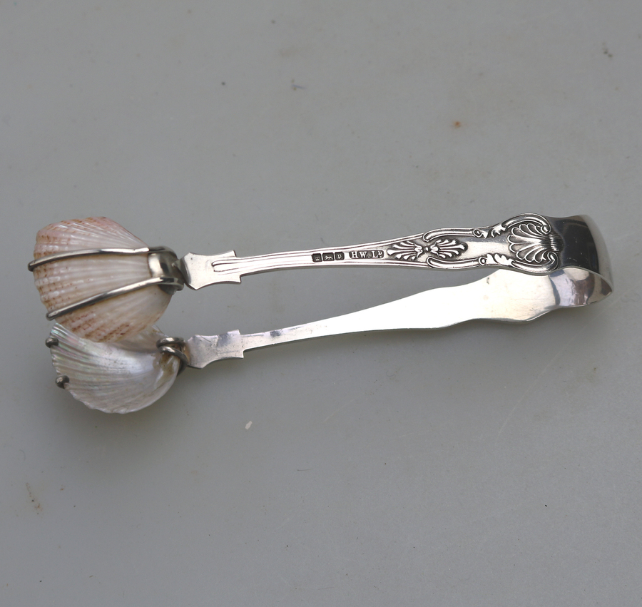 An unusual pair antique novelty solid silver shell tip Kings Tongs C.1907