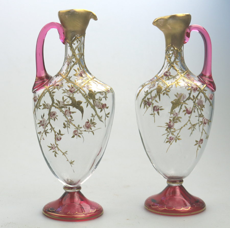 A very fine pair antique cranberry & gilt overlaid small Ewers possibly Moser C.1890