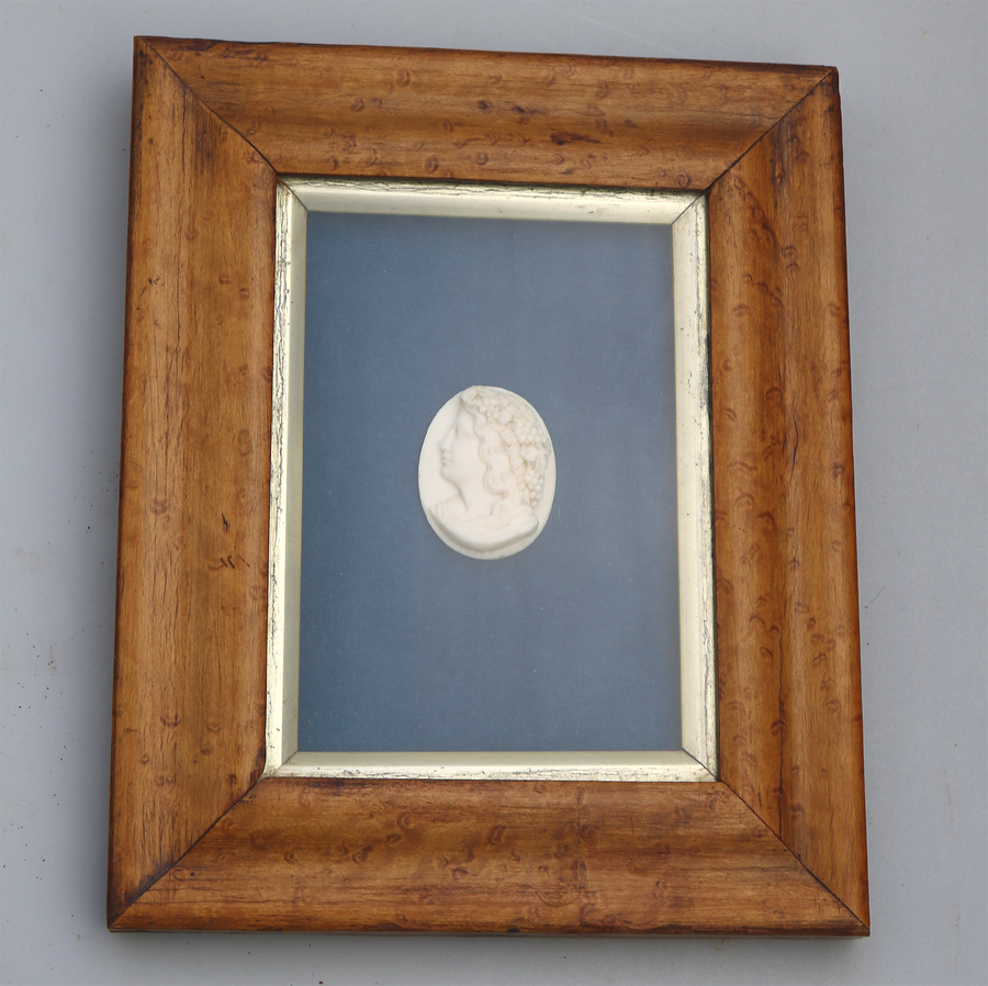 A fine antique deeply carved ivory Cameo with head of a Bacchante, framed C.19thC