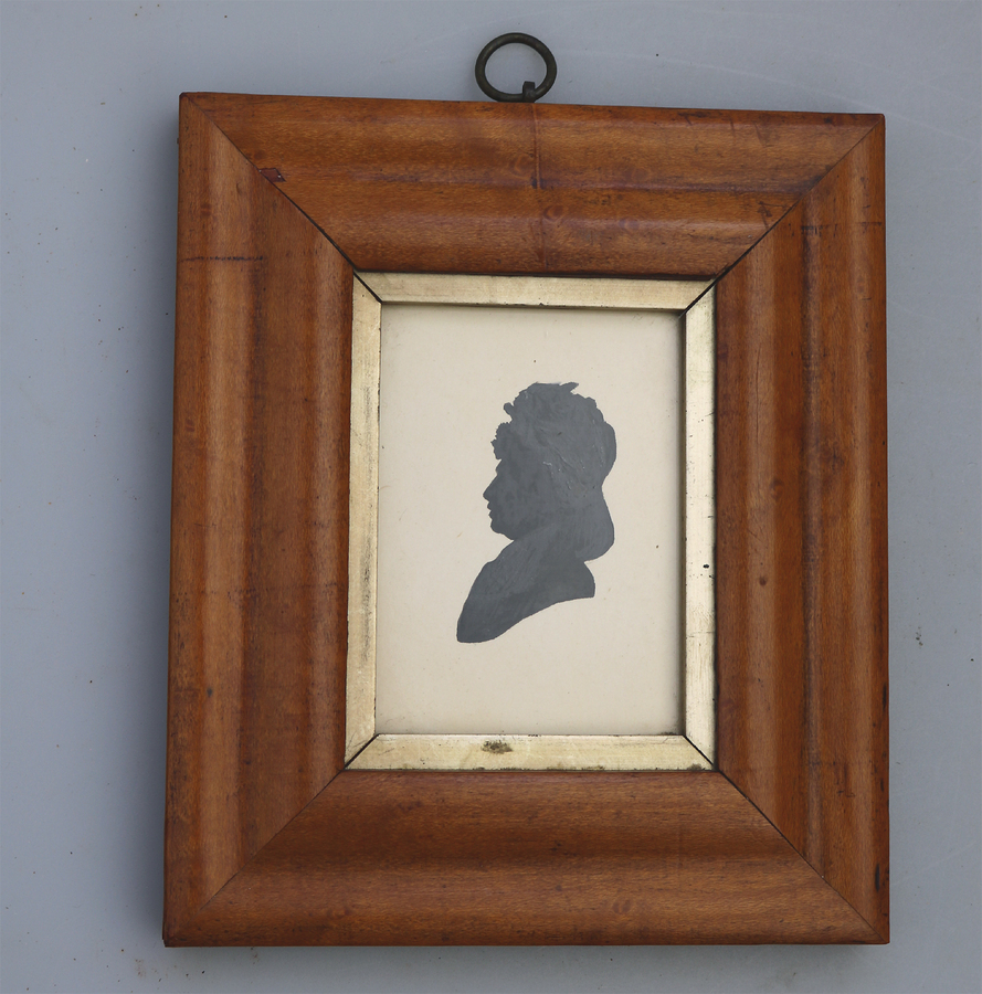 An antique painted Silhouette picture of a lady - framed - C.19thC