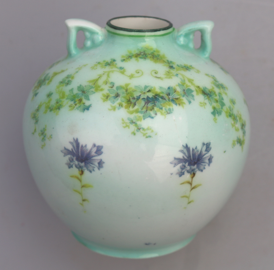 An unusual antique Royal Doulton porcelain hand painted floral Vase C.1910