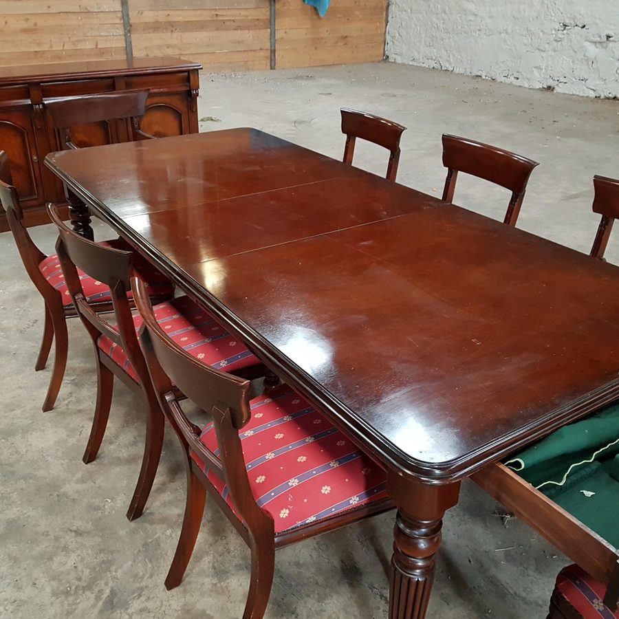 A Victorian style mahogany dining suite.