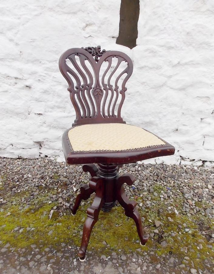 Edwardian mahogany Swivel chair. By Jas Shoolbred and Co. London.