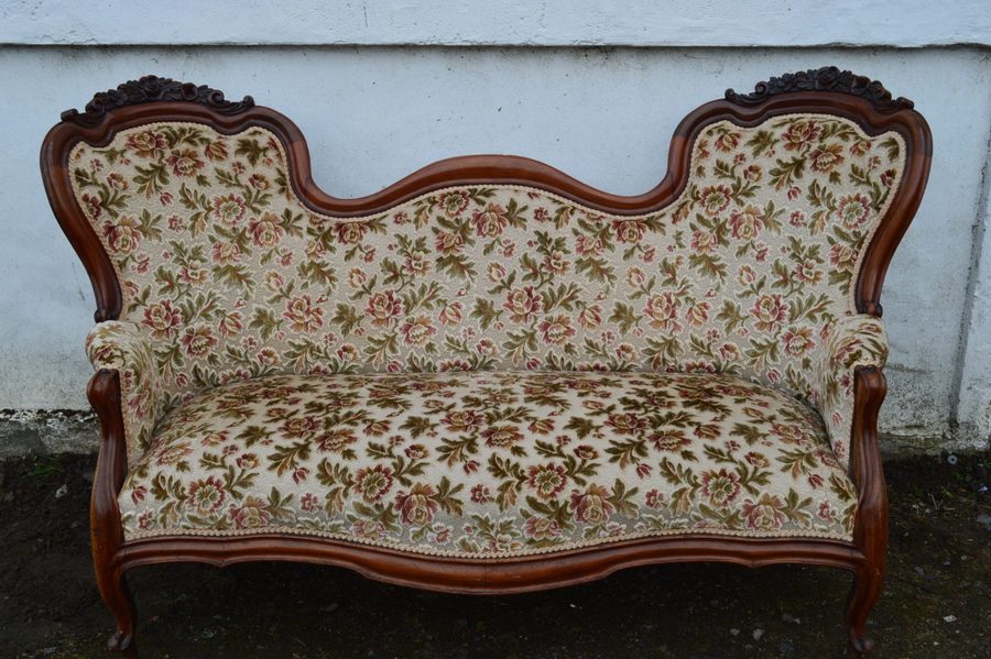 A Victorian mahogany double ended sofa