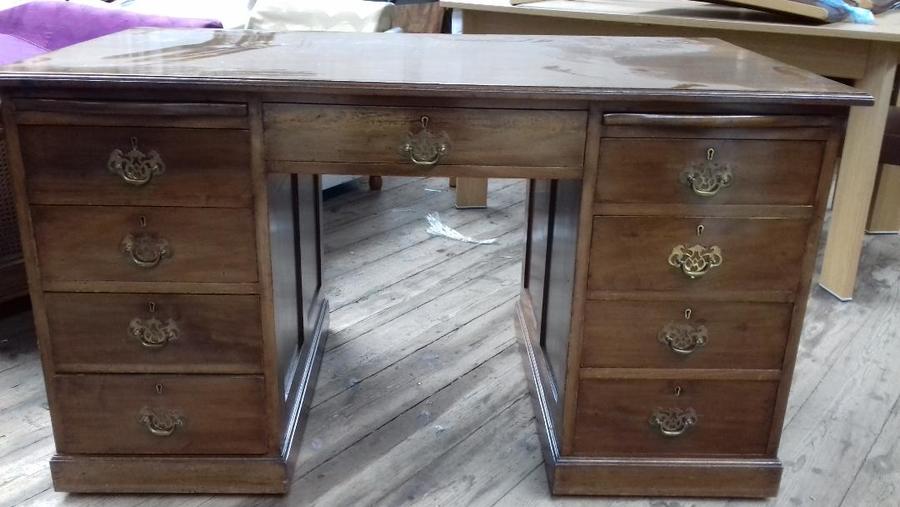 Early 20th century mahogany twin pedestal desk. polished top