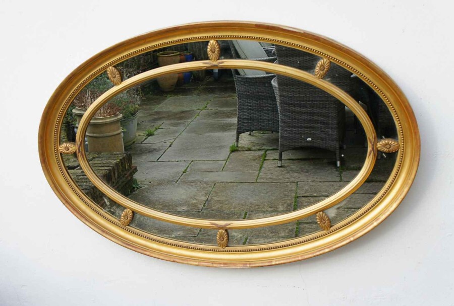 Large Edwardian oval gesso, giltwood margin mirror