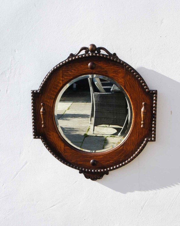 Early 20th c circular, carved Oak Jacobean style wall/hall mirror