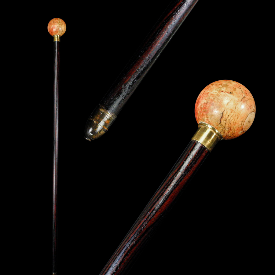 A Stained Ivory and Rosewood Walking Stick C. 20th Century.