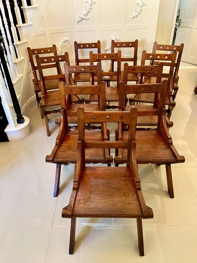 Unusual Antique Set of Twelve Gothic Pitch Pine Dining Chairs