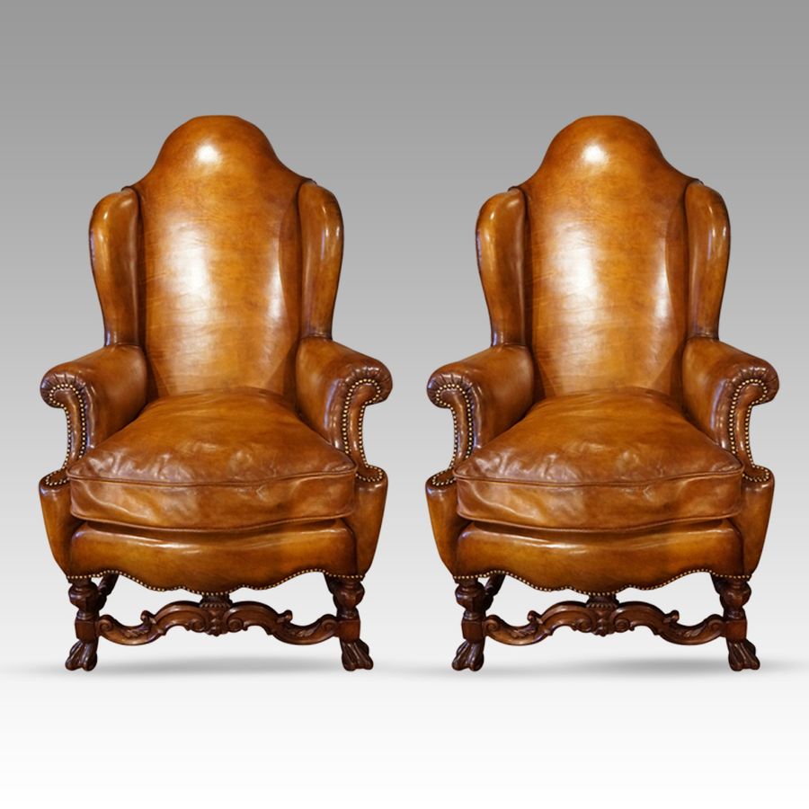 Pair of large leather wing back chairs
