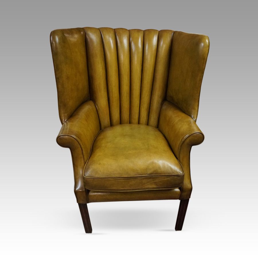 Antique 19thc. barrel back leather wing chair